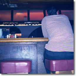 man sitting at bar