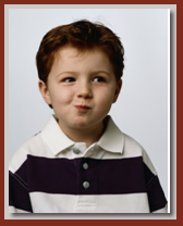 boy eating something that tastes good